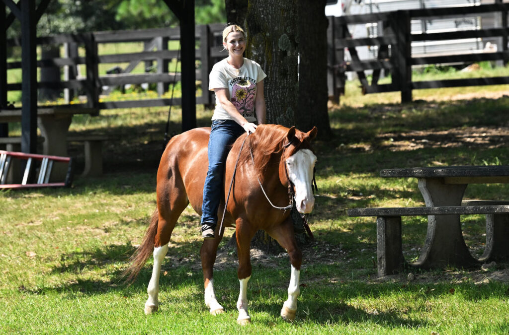 Moki buckskin AQHA gelding riding on the trail